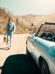 Sara is an Italian woman with a calm, natural presence. She is self-confident, clear-headed, and has a touch of rebellion about her. The setting was simple: dusty roads, an old Alfa, soft light, no big setup.